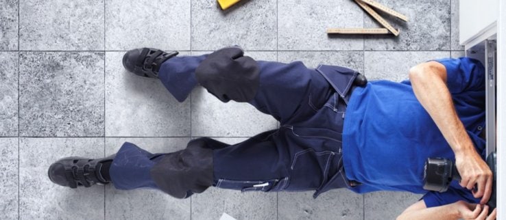 Traemand worker installing an IKEA kitchen as a service.