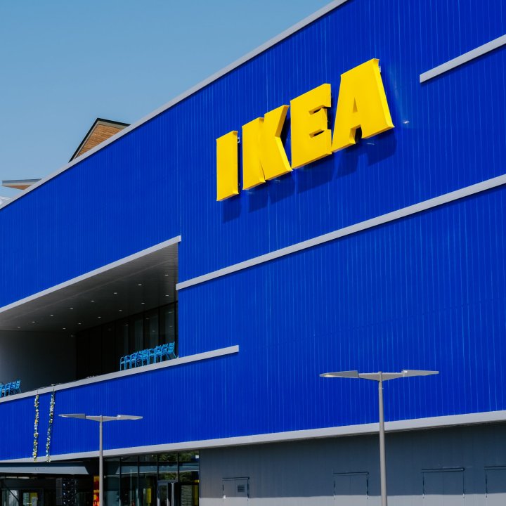 A yellow IKEA sign on a blue store exterior from an IKEA store in Nice.